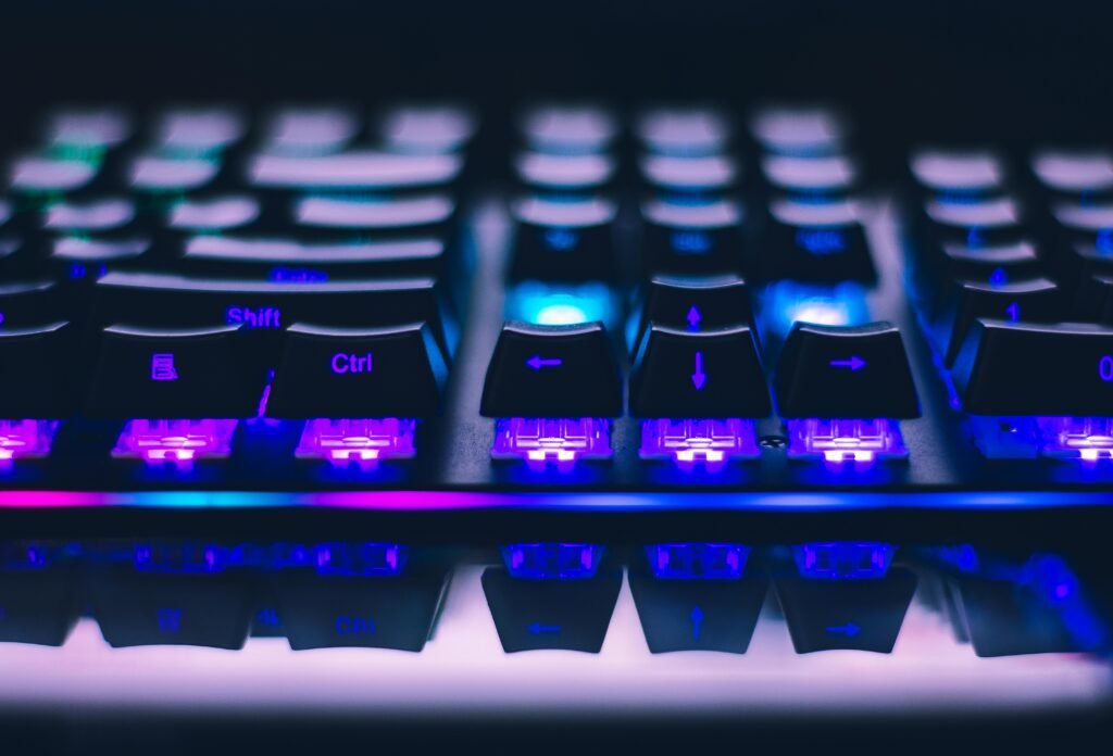 pexels photo 2115257 2115257 A detailed close-up of illuminated mechanical keyboard keys with focus on blue and purple lights.